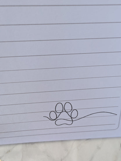 detail of paw print on inside pages of Rottweiler notebook