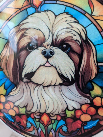 close up of schih-tzu face detail on stained glass effect hanging decoration