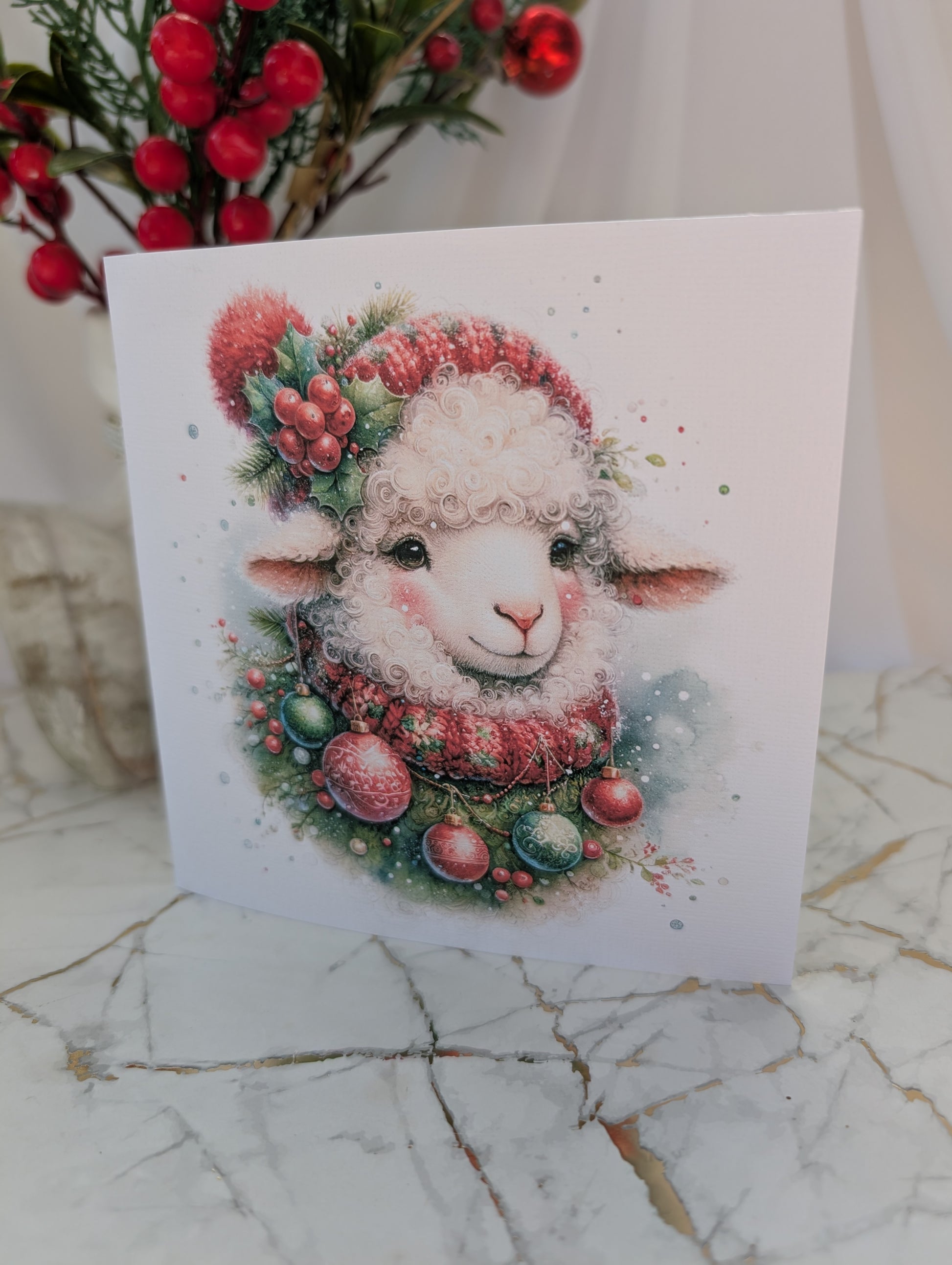 Sheep Christmas Card wearing bobble hat and scarf with baubles