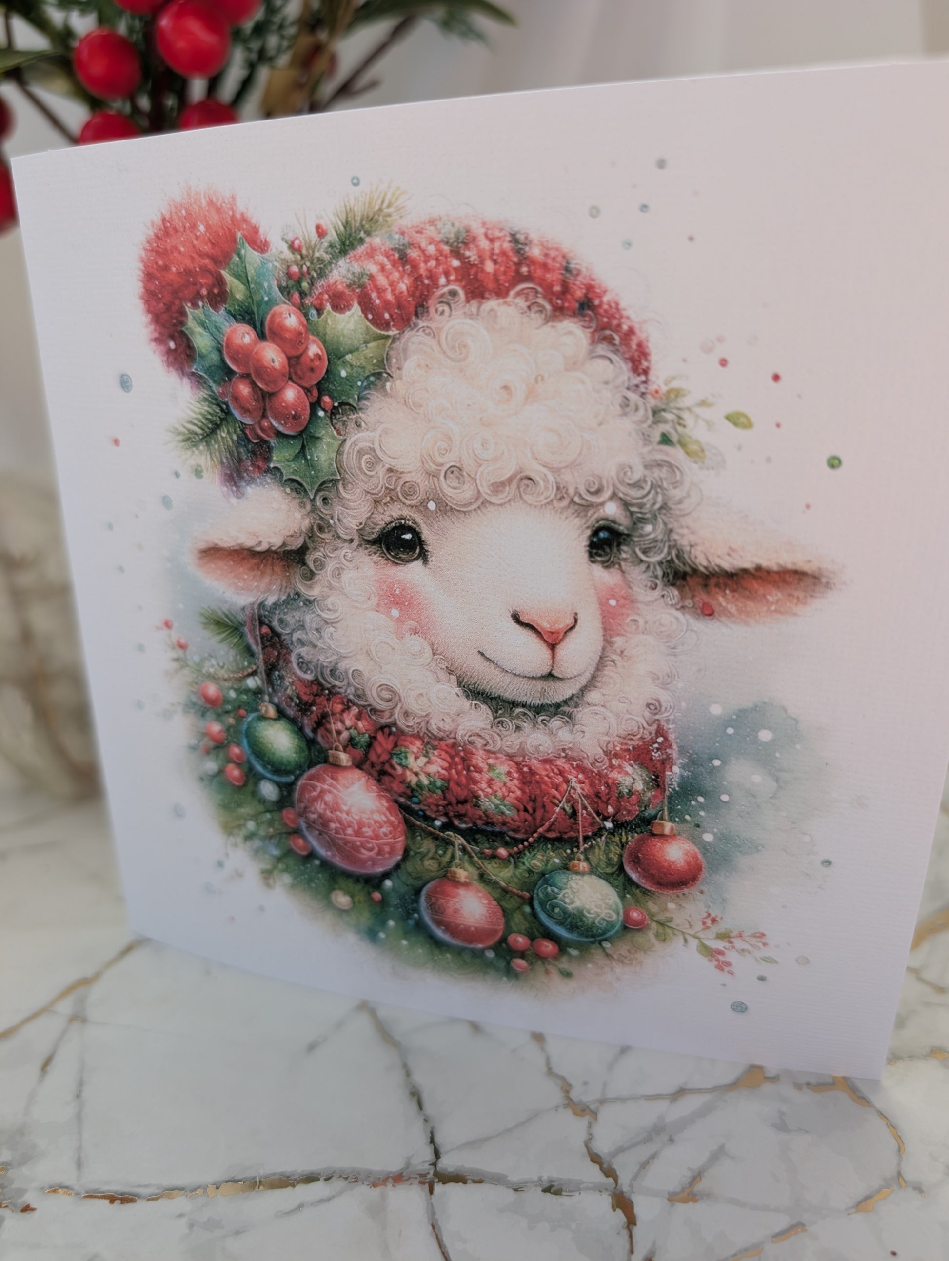 Sheep Christmas card by Paws and Glow - close up of image of sheep wearing bobble hat and scarf