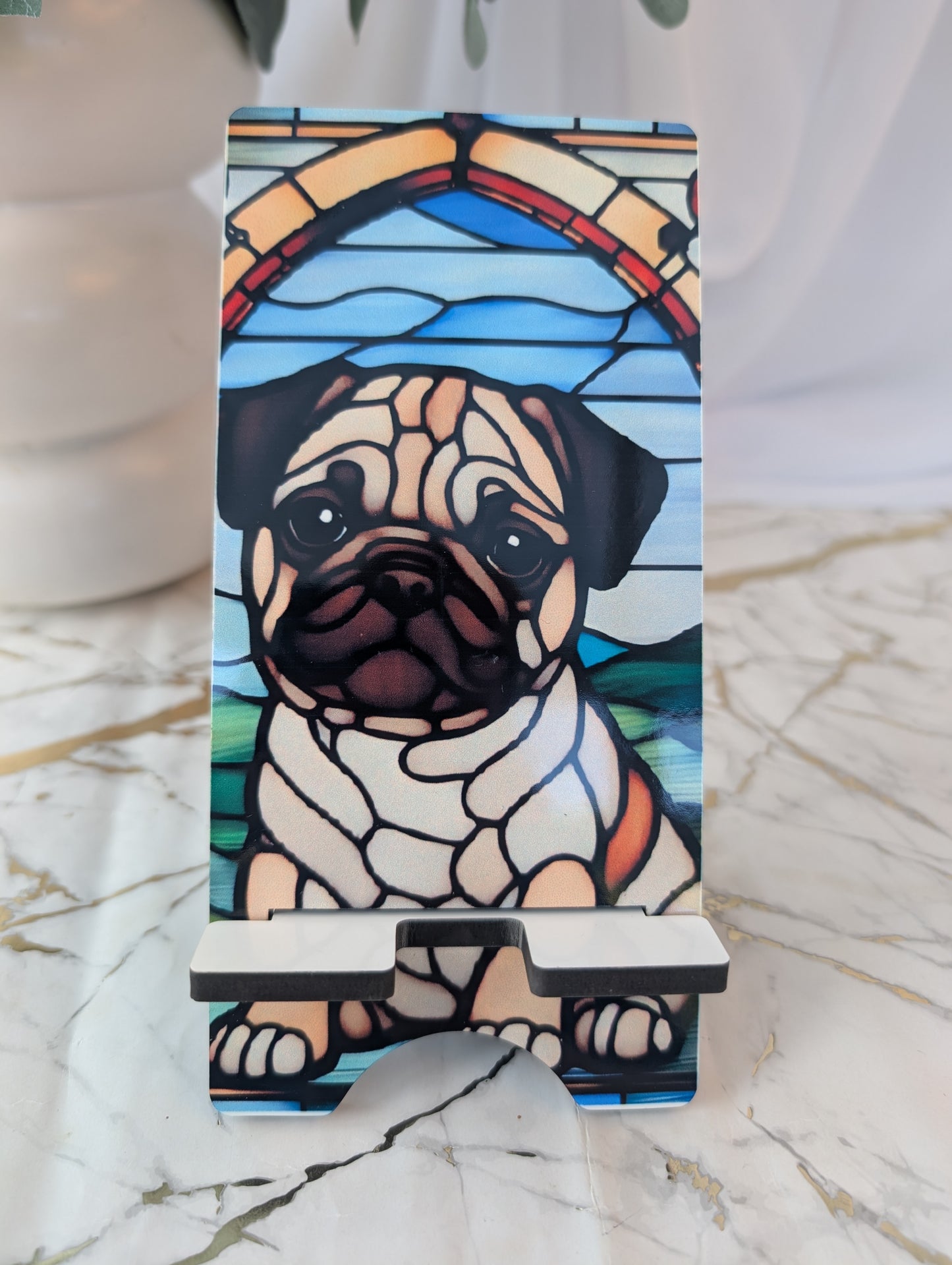 Festive Gift Idea - Mobile Phone stand with pug design in stained glass style on a marble surface
