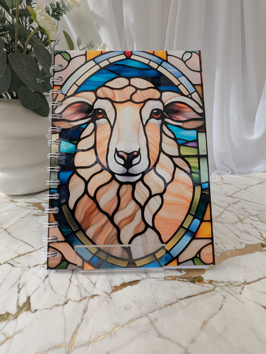 Bright colourful A5 spiral bound hardback sheep notebook in faux stained-glass style with 120gsm paper.