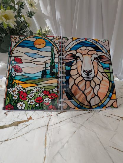 Front and back view of colourful A5 handmade glossy sheep notebook with faux stained glass design, shown open to display both covers.