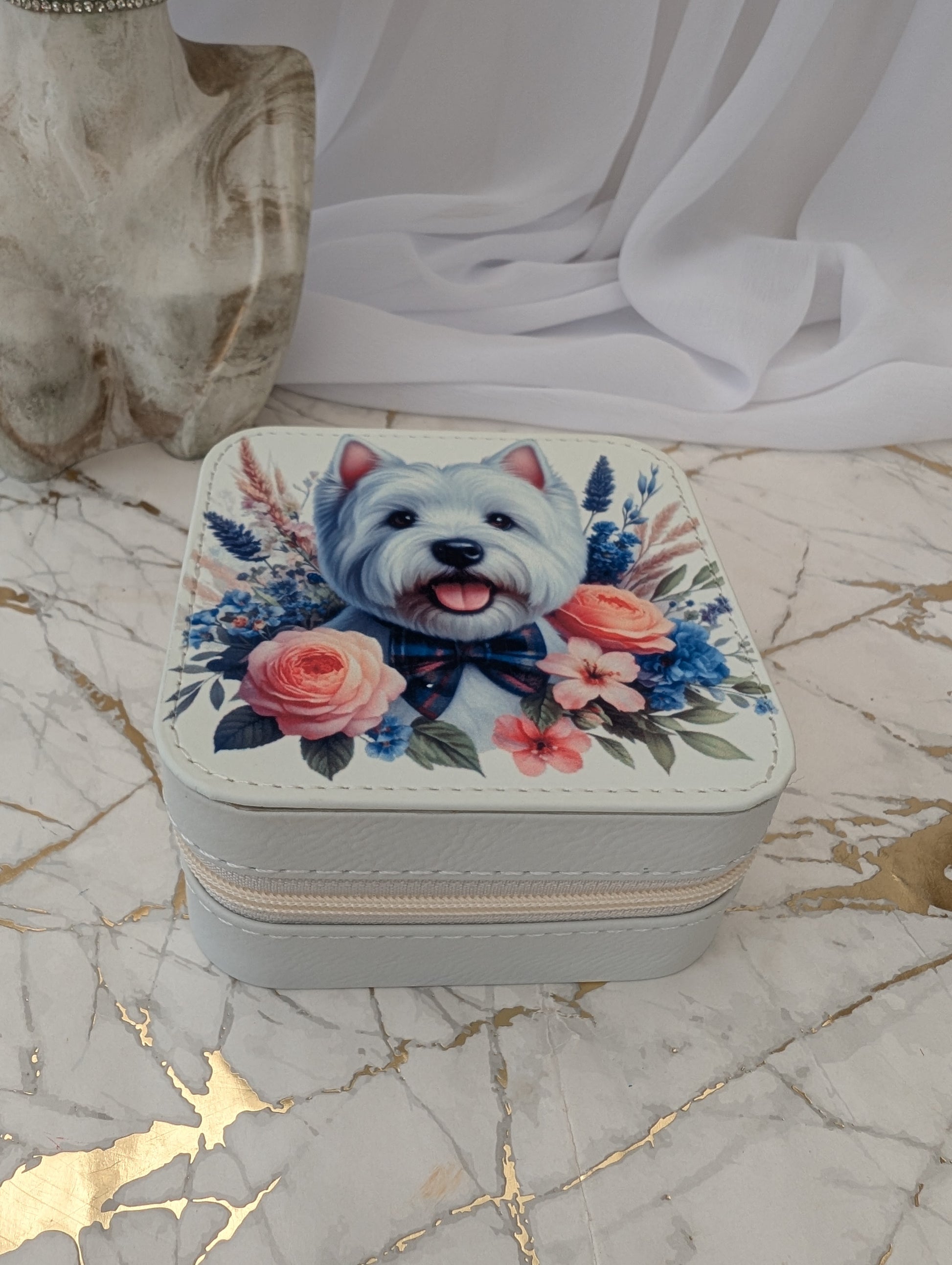 Top view of Faux Cream Leather Travel Jewellery Box with Western Highand Terrier peeping over flowers.