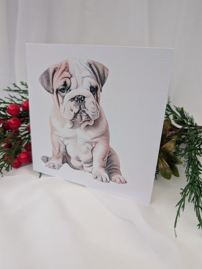 White 300gsm linen effect greeting card with watercolour style image of cute Bulldog puppy, with leaves in the background