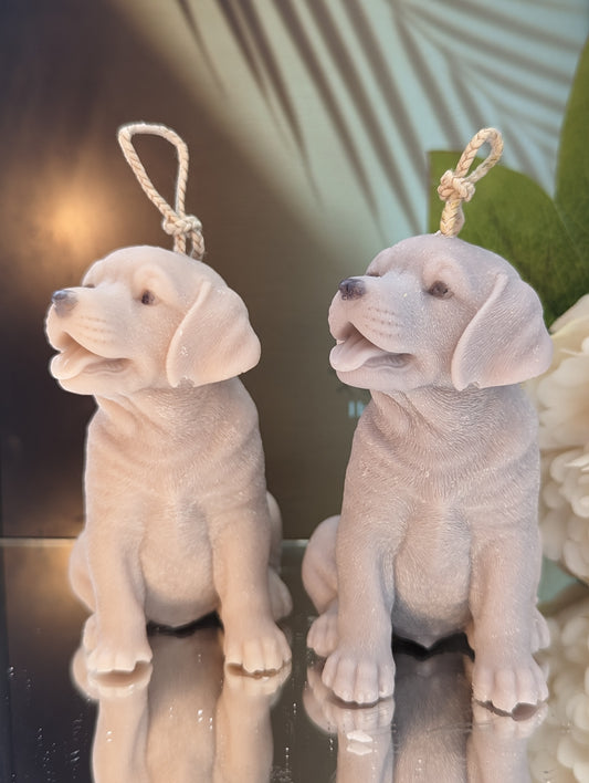 Two moulded labrador puppy candles - 1 grey and 1 cream