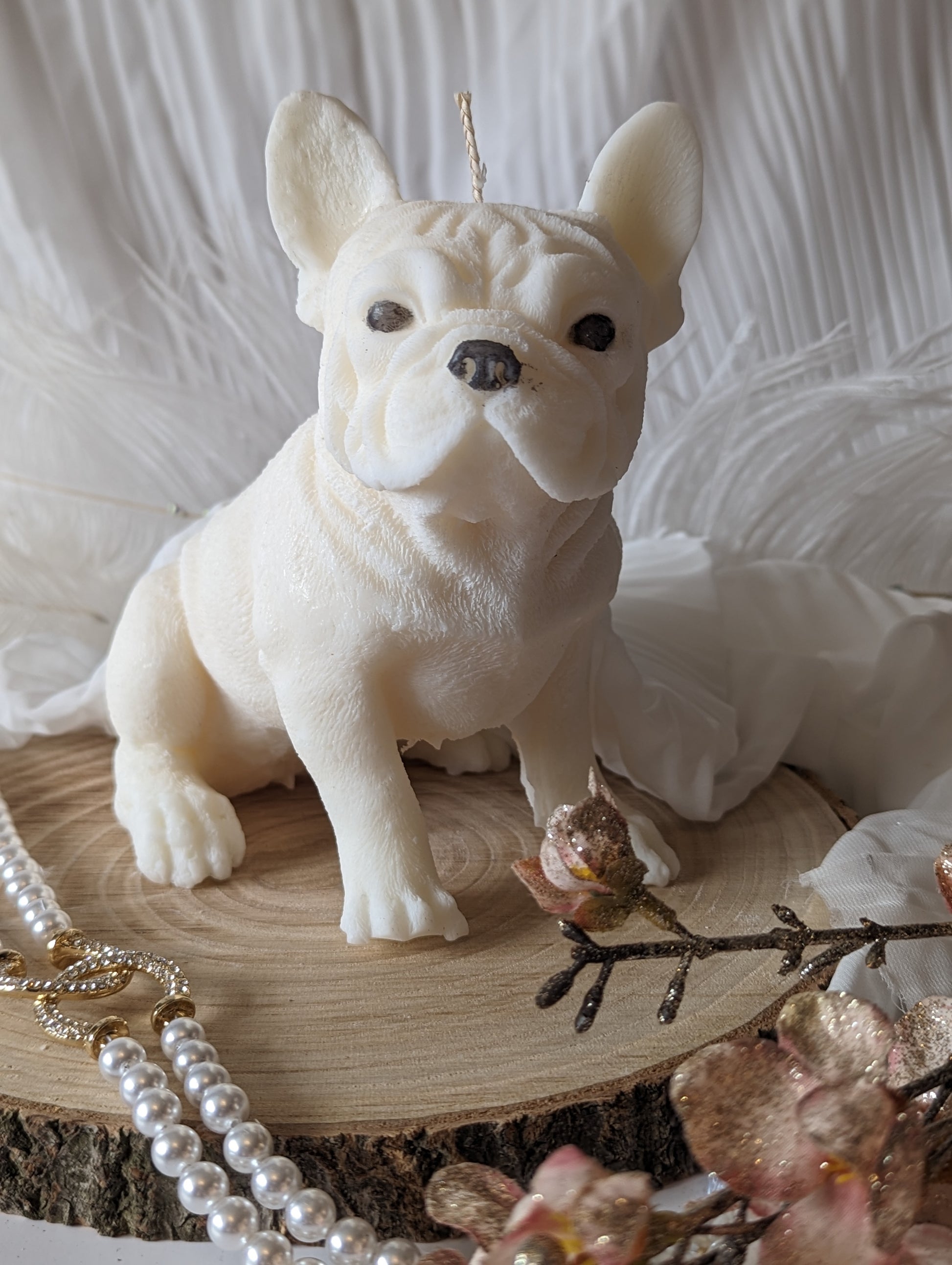 close up front view of moulded French bulldog candle