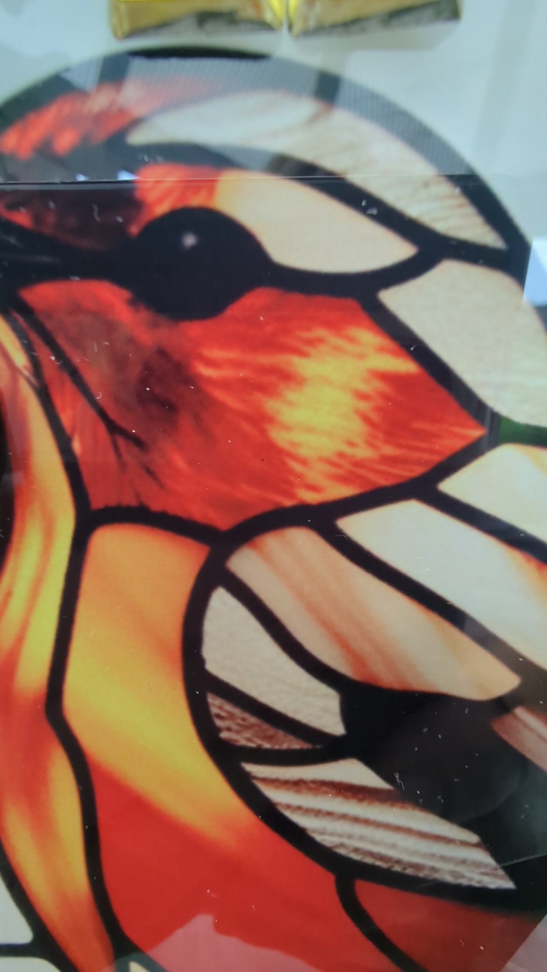 handmade robin clock with close-ups on the stained glass look and craftsmanship.