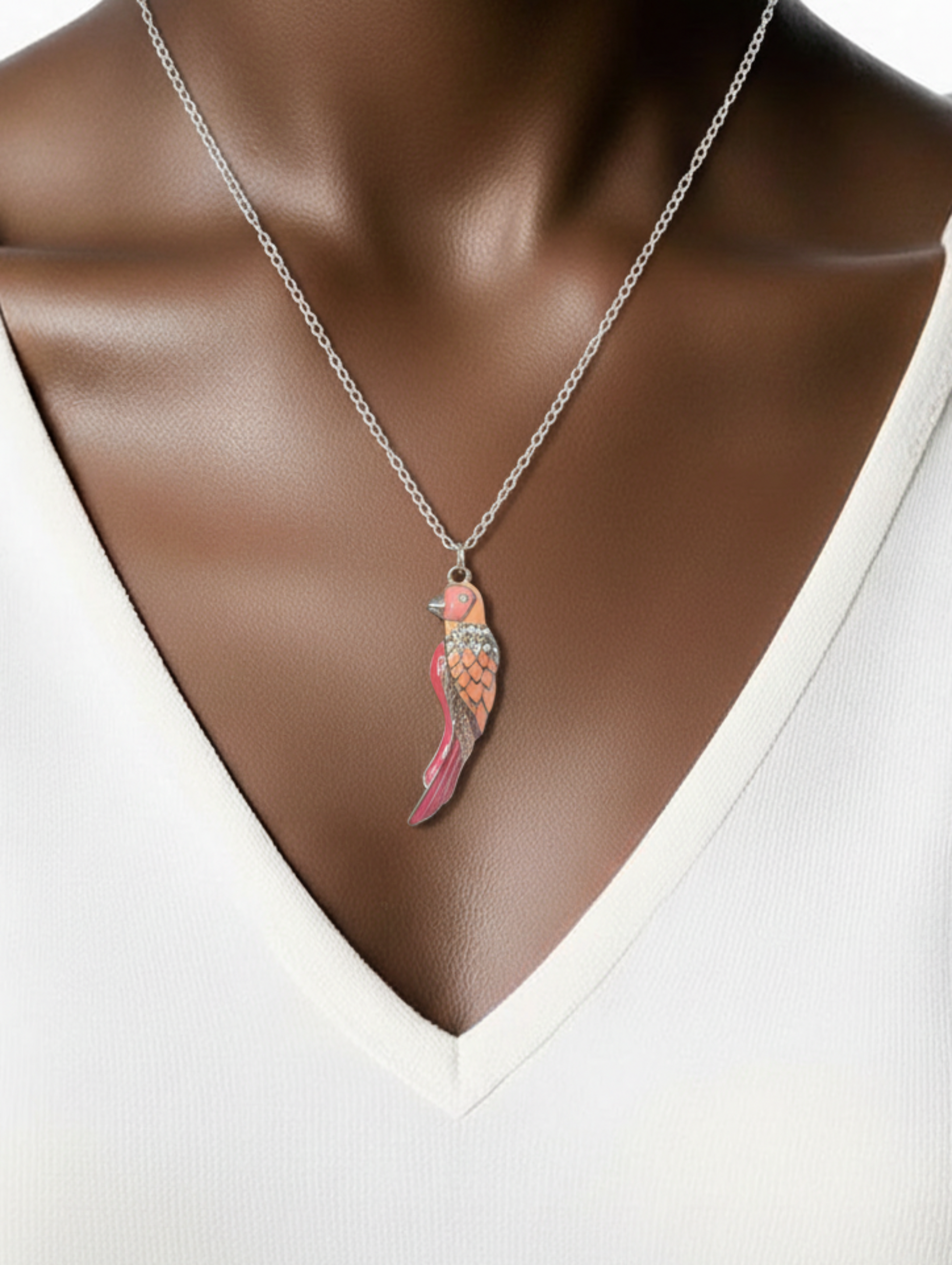 Parakeet enamel silver tone pendant on model