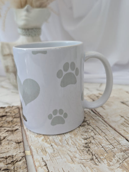 Left side view of White Ceramic Weimaraner Dog Puppy mug with background of soft grey hear, paw and bone print