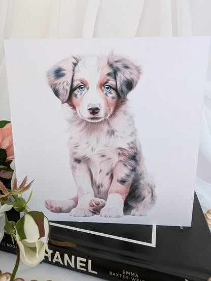 Close up view of Australian Shepherd Puppy dog card.  watercolour style printed on 300gsm linen effect white card measuring 6x6 inch square